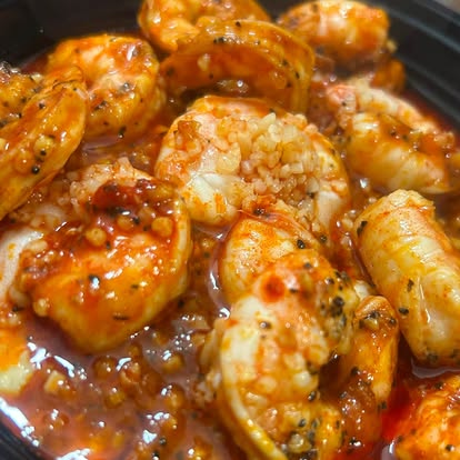 Shrimp in sauce in a skillet