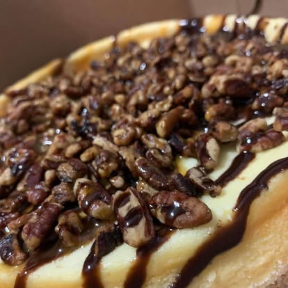 Bread pudding drizzled with caramel and pecans